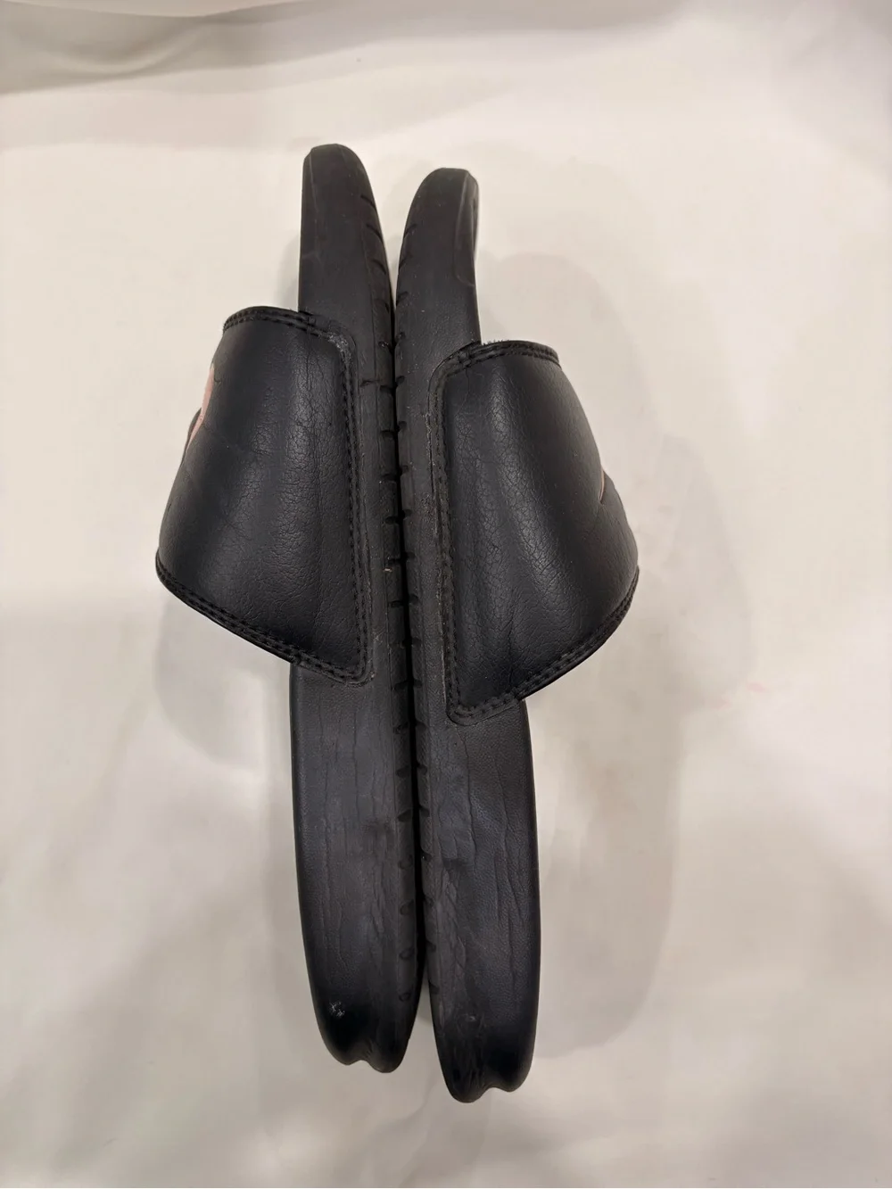 Woman’s Nike Benassi Black and Rose Gold Slides Size 7